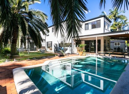 facade garage driveway pool backyard